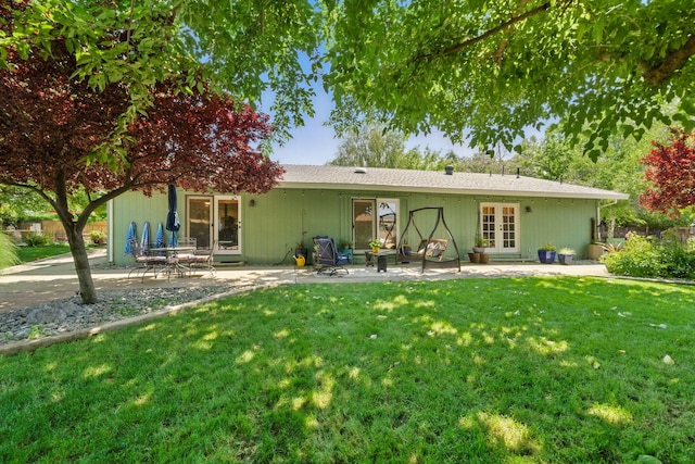 6966 Granada Dr, Redding, CA 96002 - back of property with french doors, a patio area, and a yard