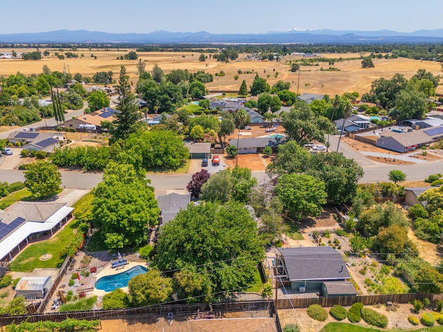 6966 Granada Dr, Redding, CA 96002 - aerial perspective of suburban area with a pool area and a mountain backdrop