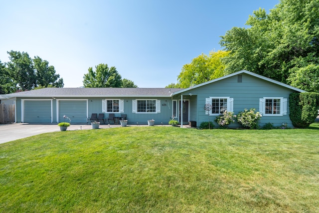 37255 Carson St, Burney, CA 96013 - ranch-style house with driveway, a garage, a front yard, and board and batten siding