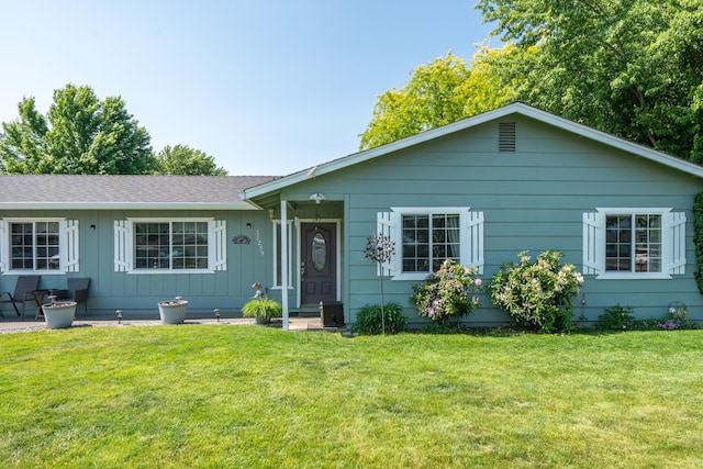 37255 Carson St, Burney, CA 96013 - ranch-style house featuring board and batten siding, a front lawn, and a shingled roof