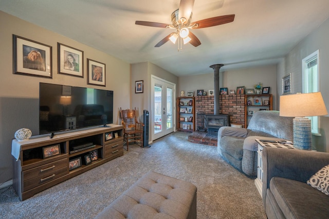 37255 Carson St, Burney, CA 96013 - living area featuring a wood stove, healthy amount of natural light, carpet, and french doors