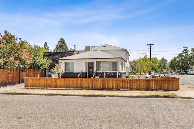 2005 E St, Redding, CA 96001 - bungalow-style home with a fenced front yard and stucco siding
