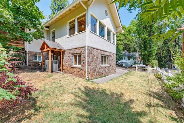 4400 Allen St, Dunsmuir, CA 96025 - rear view of property featuring stone siding, stucco siding, and central AC unit