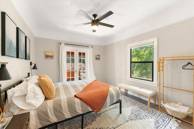 4400 Allen St, Dunsmuir, CA 96025 - bedroom with access to outside, wood finished floors, french doors, and a ceiling fan
