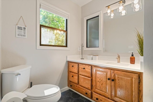 4400 Allen St, Dunsmuir, CA 96025 - half bathroom featuring toilet, vanity, tile patterned floors, and baseboards