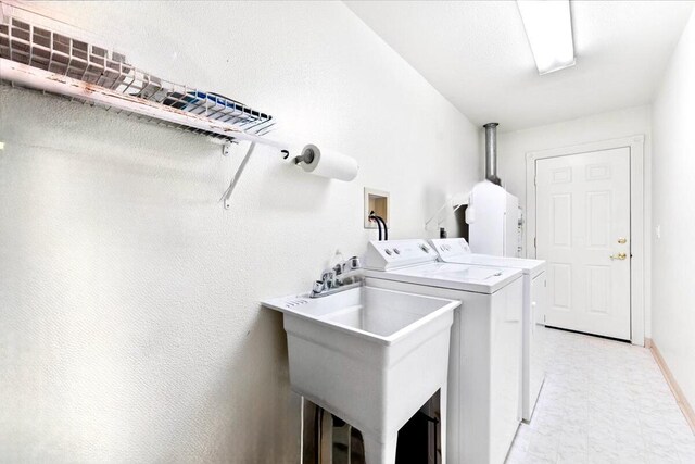 30821 Bambi Dr, Shingletown, CA 96088 - laundry room featuring washing machine and dryer and light floors