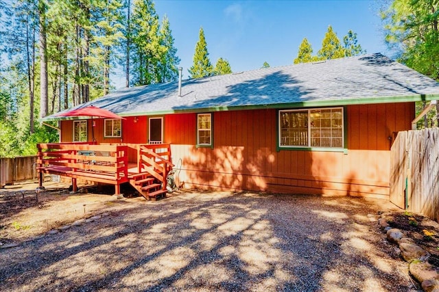 30821 Bambi Dr, Shingletown, CA 96088 - view of front of property with a wooden deck and a shingled roof