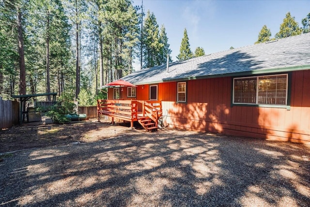 30821 Bambi Dr, Shingletown, CA 96088 - back of property featuring a wooden deck and roof with shingles