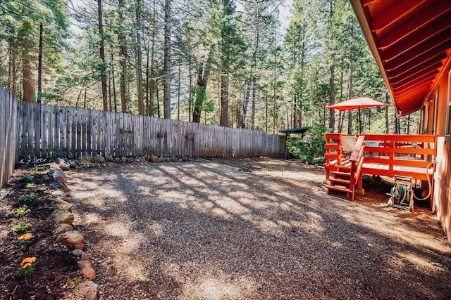 30821 Bambi Dr, Shingletown, CA 96088 - fenced backyard with a deck and a forest view