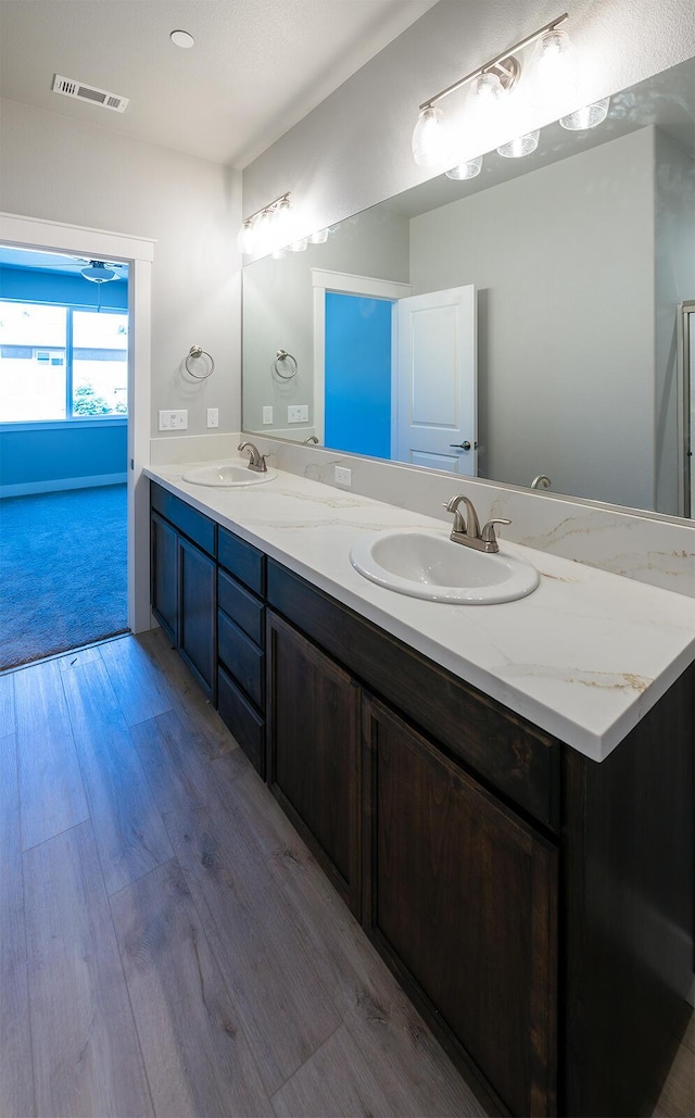 3707 Bloomsbury Ave, Shasta Lake, CA 96019 - bathroom with double vanity and wood finished floors