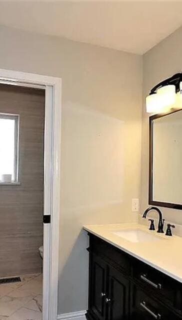 3837 Appalachian Way, Redding, CA 96001 - bathroom featuring vanity, marble look tile flooring, and toilet