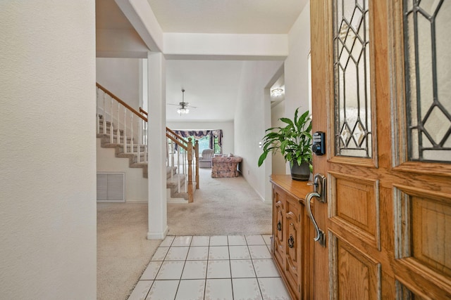 2173 Oak Ridge Dr, Redding, CA 96001 - foyer featuring light carpet, stairway, and a ceiling fan