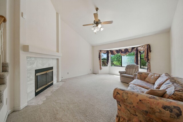 2173 Oak Ridge Dr, Redding, CA 96001 - living room featuring light carpet, a tile fireplace, high vaulted ceiling, and a ceiling fan