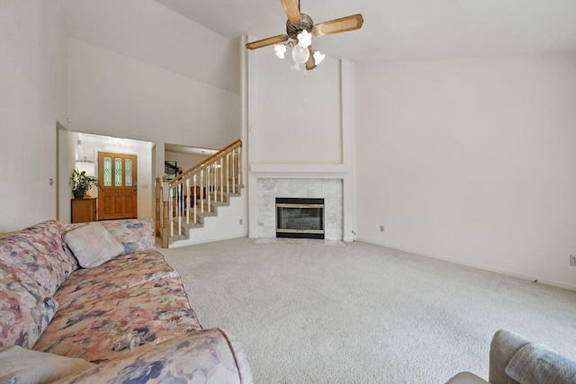 2173 Oak Ridge Dr, Redding, CA 96001 - living area with carpet flooring, stairs, high vaulted ceiling, a ceiling fan, and a fireplace