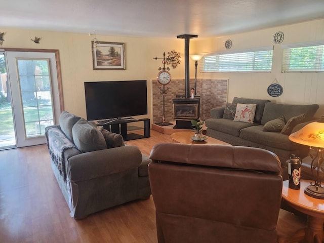 37023 Park Ave, Burney, CA 96013 - living room featuring a wood stove and wood finished floors