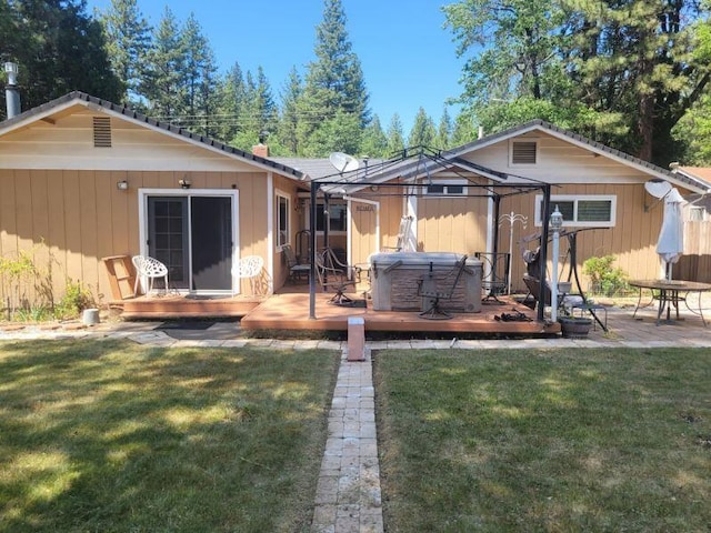 37023 Park Ave, Burney, CA 96013 - back of property featuring a hot tub, a deck, and a yard