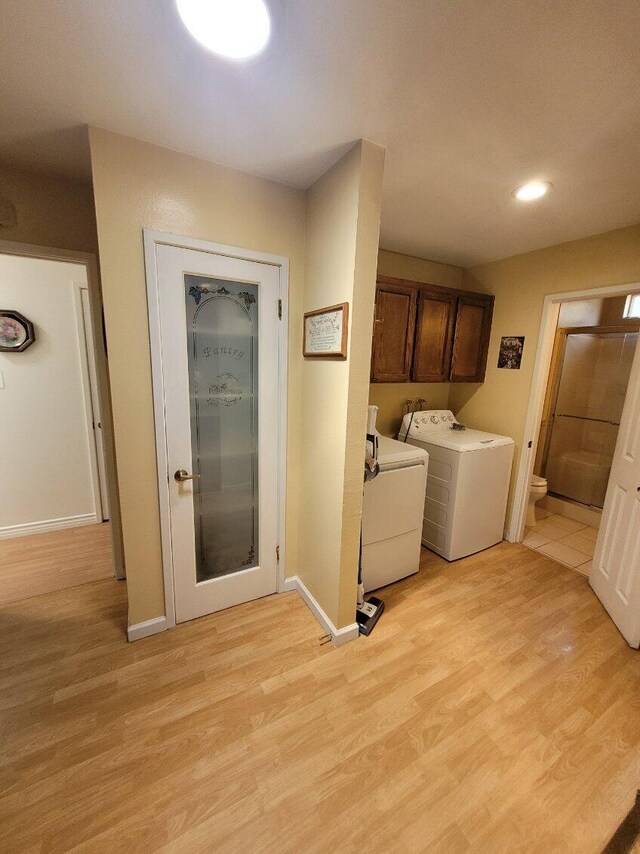 37023 Park Ave, Burney, CA 96013 - laundry area with cabinet space, light wood-style floors, washer and dryer, and recessed lighting
