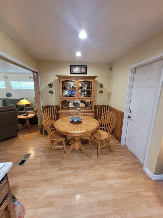 37023 Park Ave, Burney, CA 96013 - dining room with wainscoting, light wood-type flooring, recessed lighting, and wooden walls