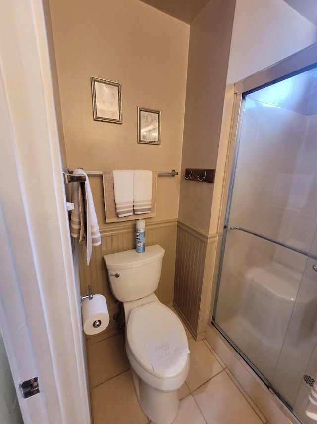 37023 Park Ave, Burney, CA 96013 - full bath featuring tile patterned flooring, a wainscoted wall, and a shower stall