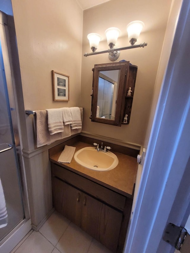 37023 Park Ave, Burney, CA 96013 - bathroom featuring vanity, tile patterned flooring, and a stall shower