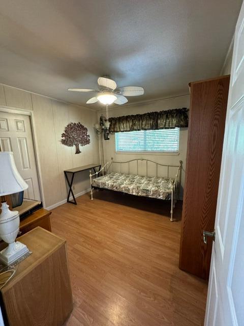 37023 Park Ave, Burney, CA 96013 - bedroom featuring wood finished floors and a ceiling fan