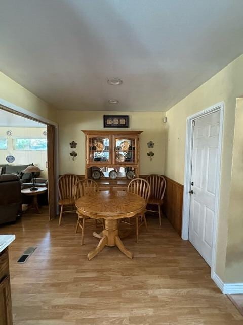 37023 Park Ave, Burney, CA 96013 - dining area with light wood-type flooring and wainscoting