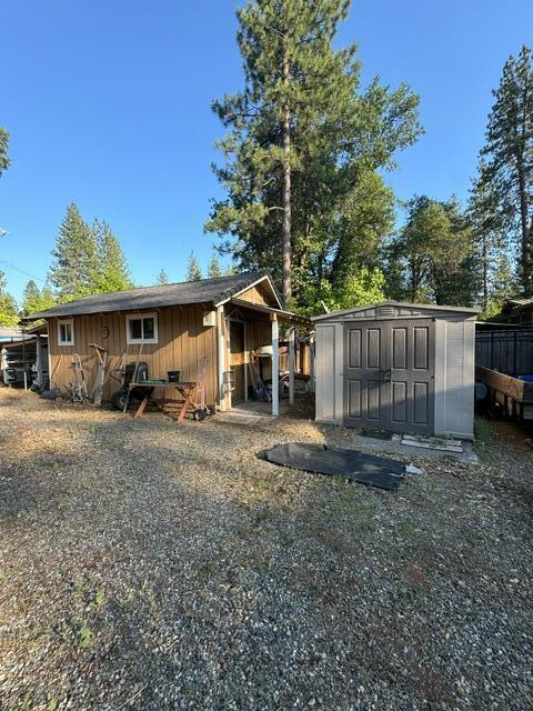 37023 Park Ave, Burney, CA 96013 - rear view of property with a storage unit and board and batten siding