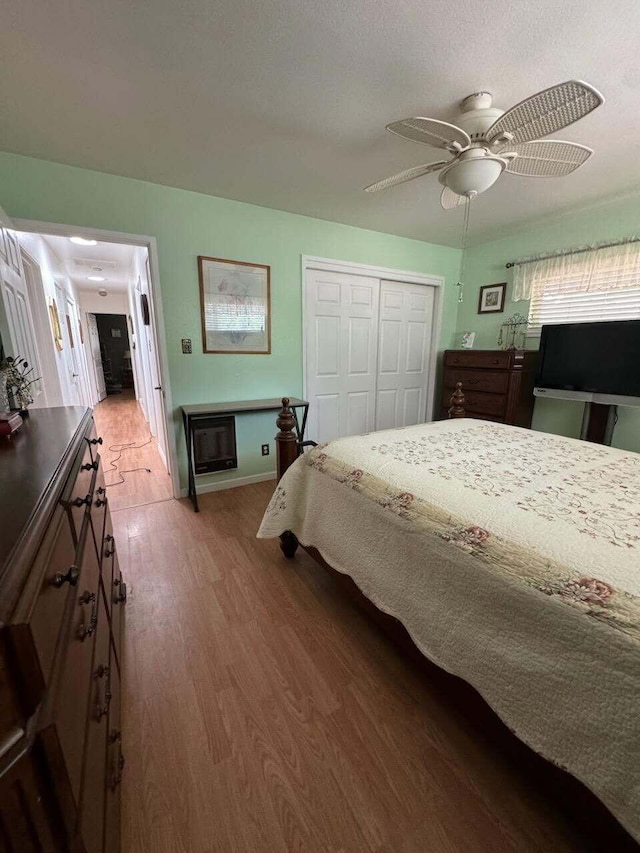 37023 Park Ave, Burney, CA 96013 - bedroom with light wood-type flooring, a closet, and a ceiling fan