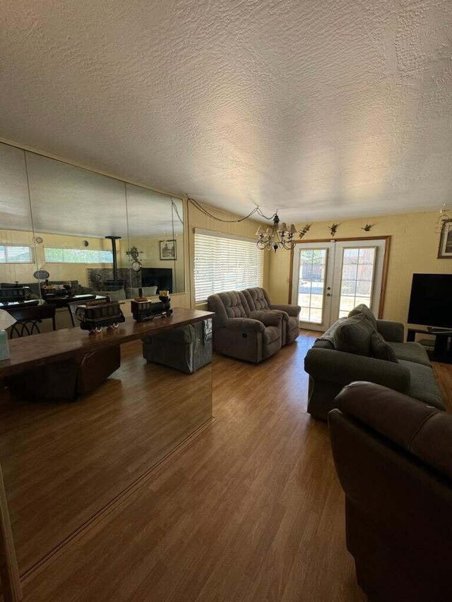 37023 Park Ave, Burney, CA 96013 - living area with wood finished floors, a textured ceiling, and a chandelier