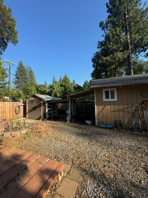 37023 Park Ave, Burney, CA 96013 - view of yard with a storage shed and a carport
