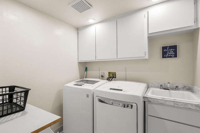 409 Ridgecrest Trl, Redding, CA 96003 - laundry room featuring cabinet space and washing machine and dryer