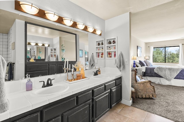409 Ridgecrest Trl, Redding, CA 96003 - ensuite bathroom with double vanity and tile patterned flooring