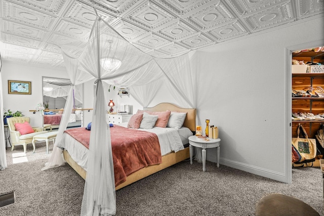 409 Ridgecrest Trl, Redding, CA 96003 - carpeted bedroom featuring an ornate ceiling and a walk in closet