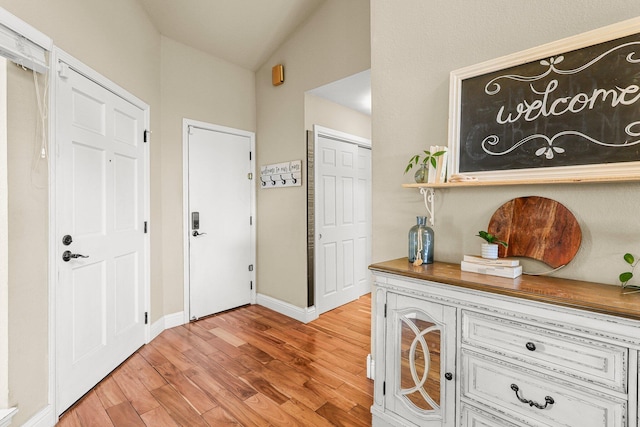 409 Ridgecrest Trl, Redding, CA 96003 - foyer with light wood finished floors and vaulted ceiling