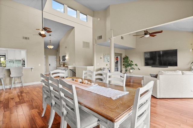 409 Ridgecrest Trl, Redding, CA 96003 - dining space with ceiling fan, high vaulted ceiling, light wood-style floors, and healthy amount of natural light