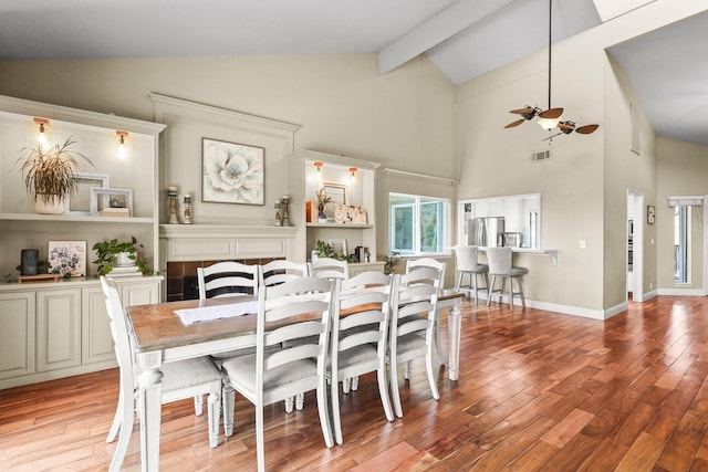 409 Ridgecrest Trl, Redding, CA 96003 - dining area featuring ceiling fan, light wood finished floors, beamed ceiling, and high vaulted ceiling