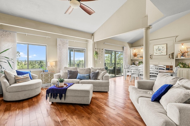 409 Ridgecrest Trl, Redding, CA 96003 - living room with decorative columns, ceiling fan, hardwood / wood-style flooring, and high vaulted ceiling