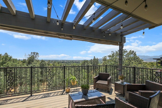 409 Ridgecrest Trl, Redding, CA 96003 - wooden deck featuring an outdoor hangout area, a pergola, and a mountain view