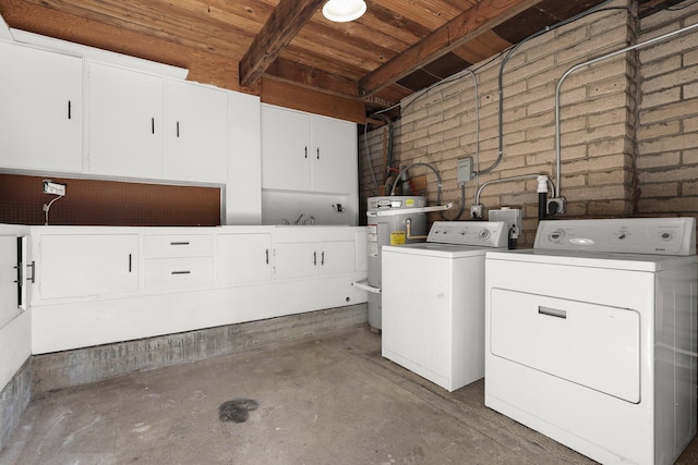 2955 Shasta St, Redding, CA 96001 - laundry room with cabinet space, washing machine and clothes dryer, electric water heater, wood ceiling, and brick wall