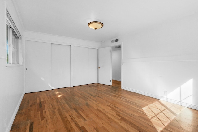 2955 Shasta St, Redding, CA 96001 - unfurnished bedroom featuring wood-type flooring, a closet, and crown molding