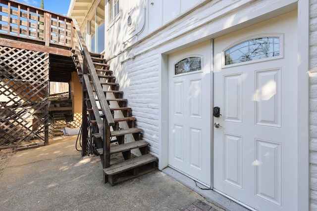 2955 Shasta St, Redding, CA 96001 - doorway to property with board and batten siding and a deck