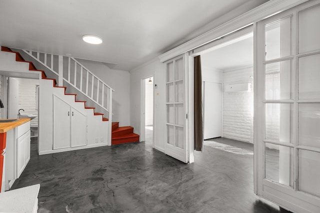 2955 Shasta St, Redding, CA 96001 - foyer entrance with concrete floors, stairs, and a wall mounted AC