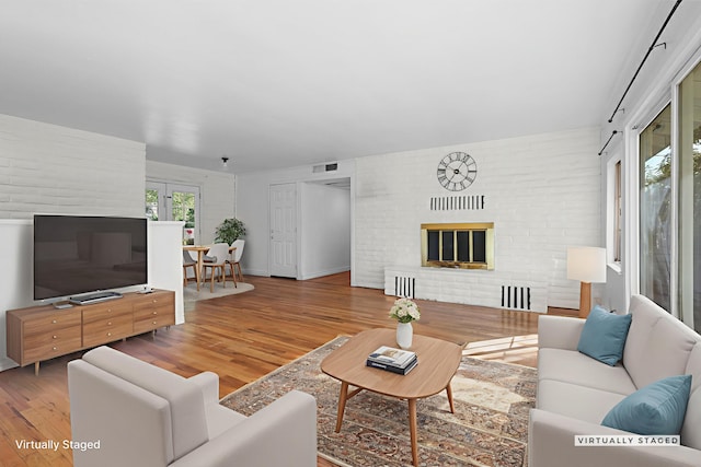 2955 Shasta St, Redding, CA 96001 - living area featuring wood finished floors and a glass covered fireplace