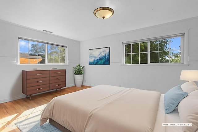 2955 Shasta St, Redding, CA 96001 - bedroom with multiple windows and light wood finished floors