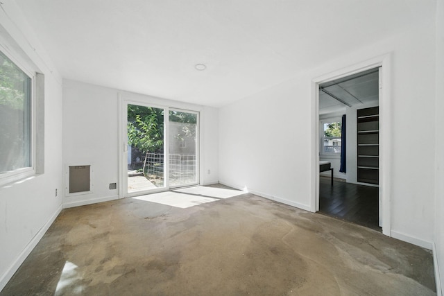 2122 Grape Ave, Redding, CA 96001 - spare room featuring healthy amount of natural light and concrete floors