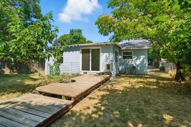 2122 Grape Ave, Redding, CA 96001 - rear view of house with a wooden deck and stucco siding