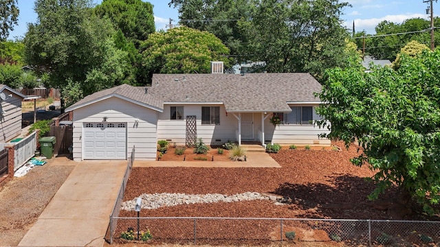 3921 Mercury Dr, Redding, CA 96002 - ranch-style house with concrete driveway, an attached garage, and a shingled roof