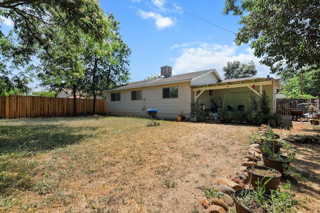 3921 Mercury Dr, Redding, CA 96002 - rear view of house with a fenced backyard