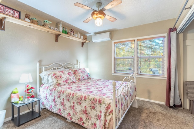 3274 Quartz Hill Rd, Redding, CA 96003 - bedroom featuring carpet floors, a wall mounted AC, baseboards, a ceiling fan, and a textured ceiling