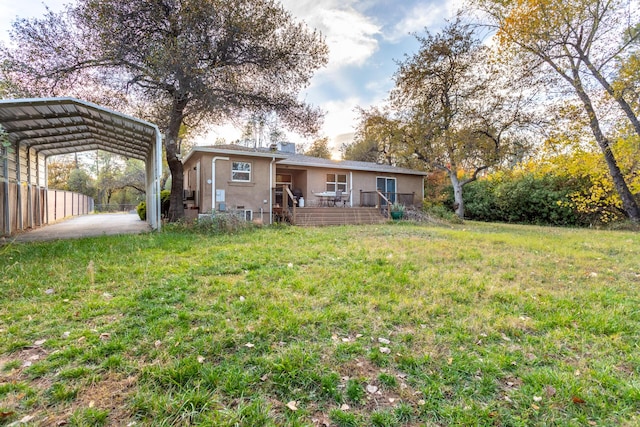 3274 Quartz Hill Rd, Redding, CA 96003 - rear view of property featuring a detached carport, stucco siding, and a wooden deck
